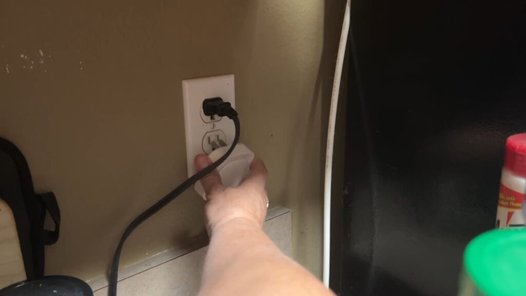 Next to the fridge