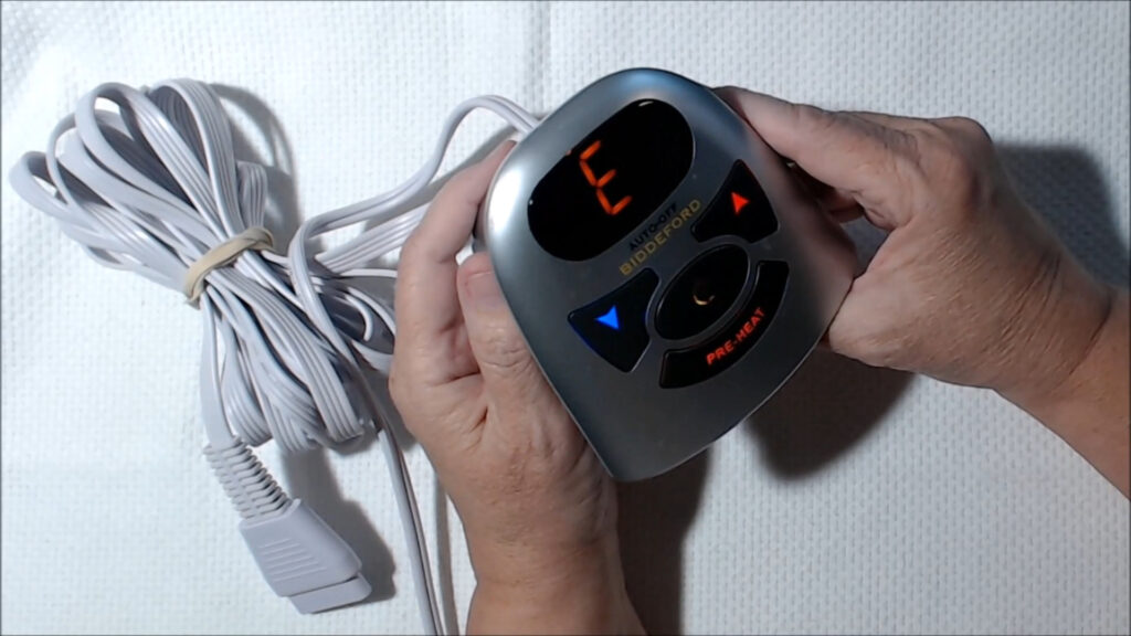 Biddeford heated mattress pad with connectors and dual temperature controllers.