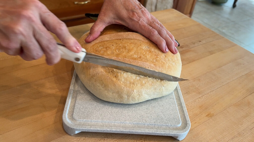 cutting the baked bread