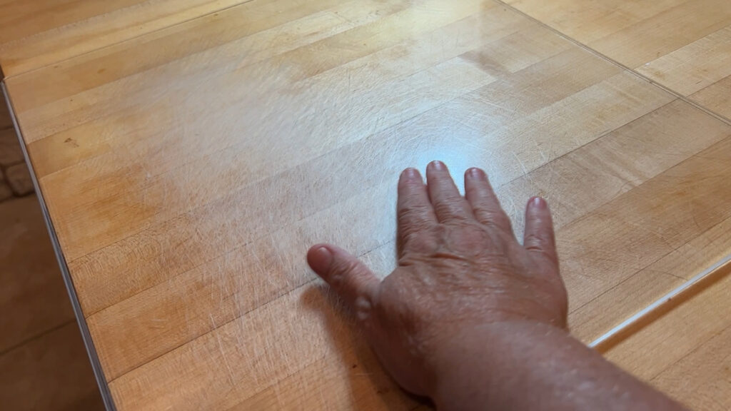 clear cutting board on butcher block
