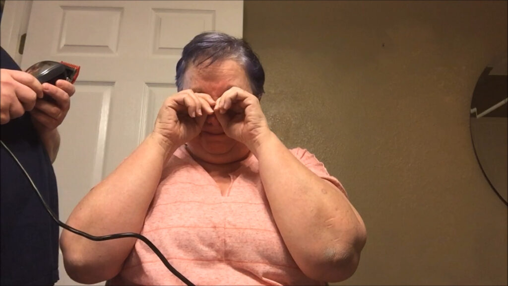 Jen getting ready to shave her head