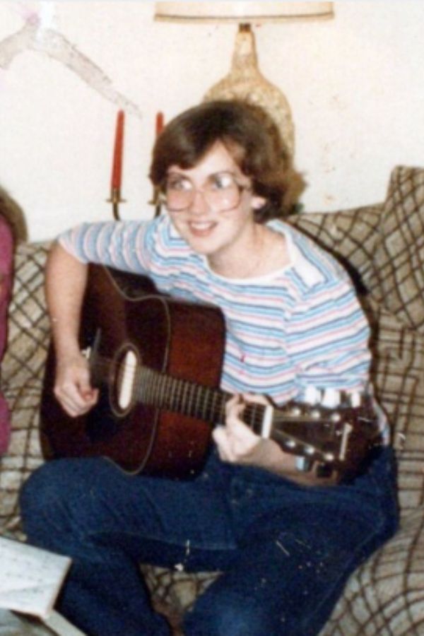 Young Invisible Jen playing guitar